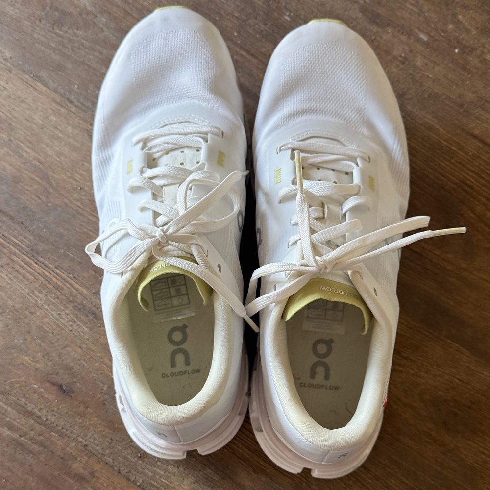 On Running White Sneakers with Pale Yellow Accents